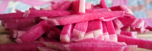 Photo of watermelon radish cut into matchsticks or ribbons